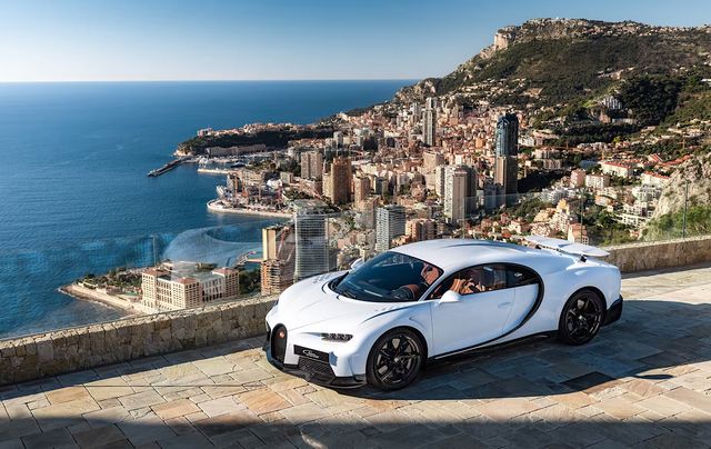 A white Bugatti Chiron above the Monaco waterfront