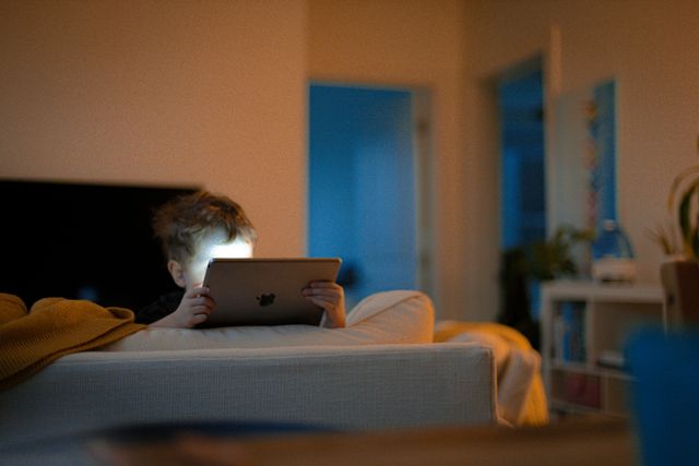 child-immersed-in-ipad